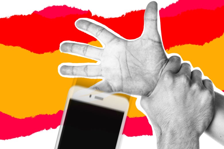 A man grabs a woman's wrist, making her drop her smartphone.